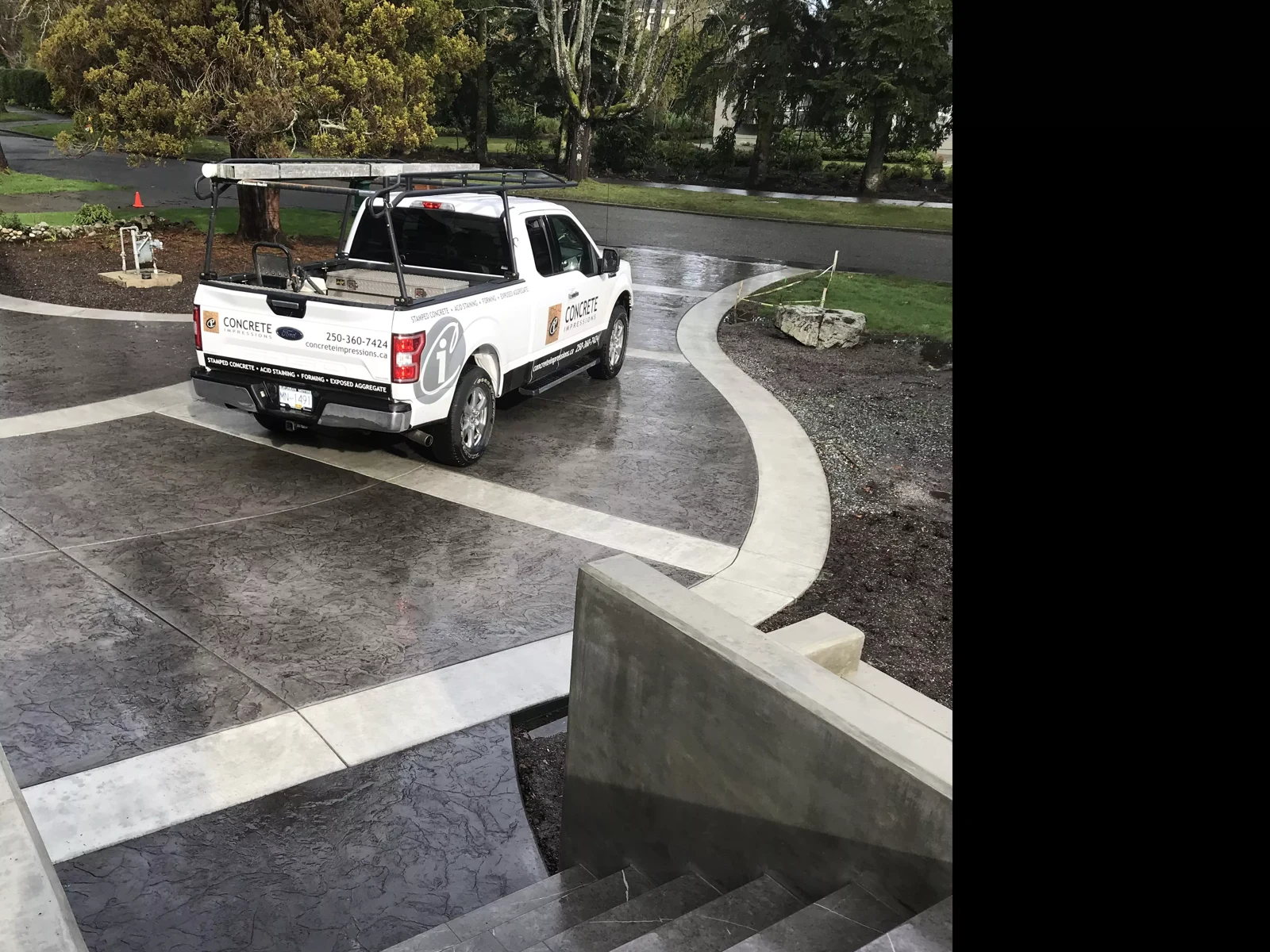Concrete Impressions truck on a stamped driveway with sweeping contrasting borders