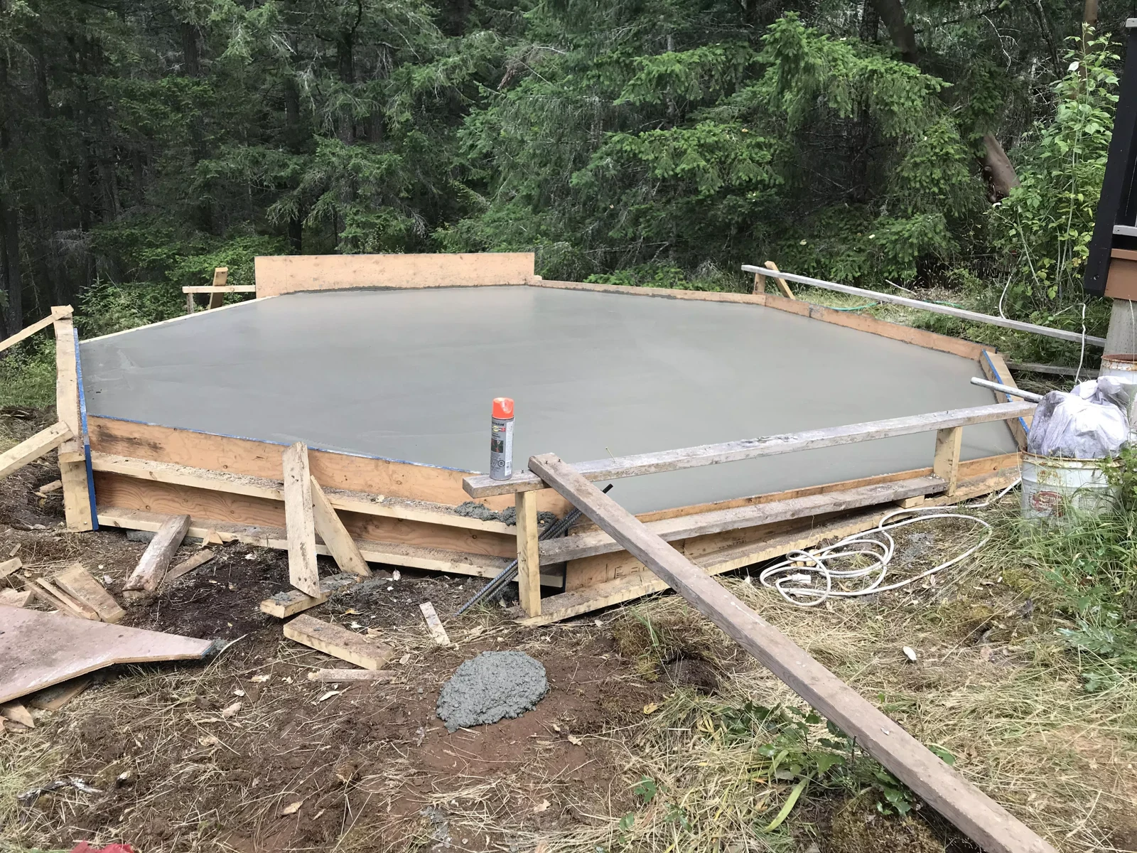 Freshly placed concrete contained by curved formwork
