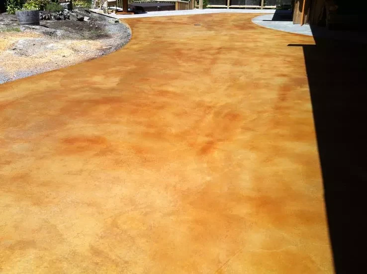 Warm amber acid-stained outdoor concrete